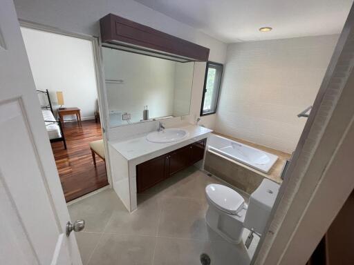 Modern bathroom with dual vanity and large bathtub