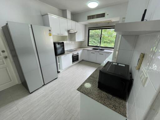 Spacious kitchen with modern appliances and ample counter space
