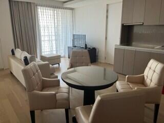 Modern living room with natural light and beige furniture