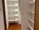 Spacious built-in closet with multiple shelves in a well-lit room