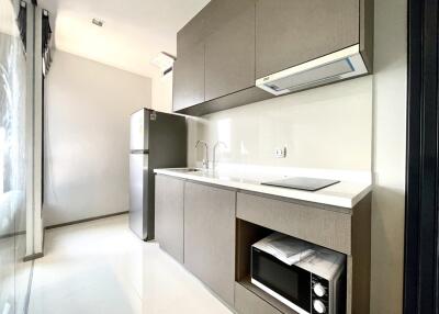 Modern kitchen with stainless steel appliances and minimalist design