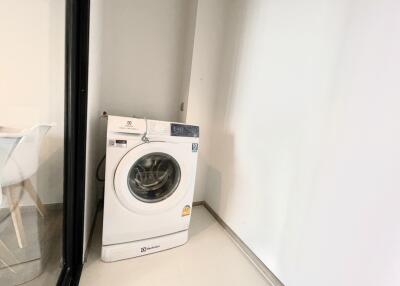 Compact utility room with a washing machine