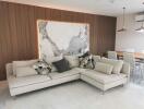 Modern living room with sectional sofa and decorative wall panel