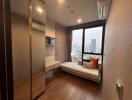 Compact bedroom with large window and city view