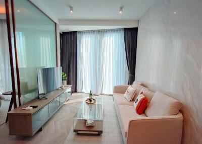 Modern living room interior with large television and comfortable sofa