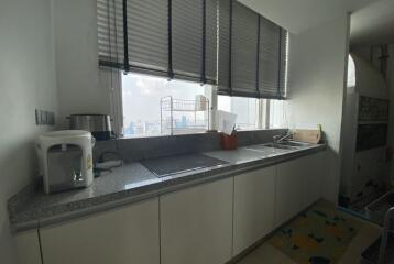 Modern kitchen with a large window and city view