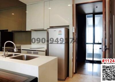 Modern kitchen with stainless steel appliances and wooden cabinets