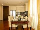 Elegant dining room with set table and modern appliances