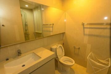 Modern bathroom interior with beige tiles