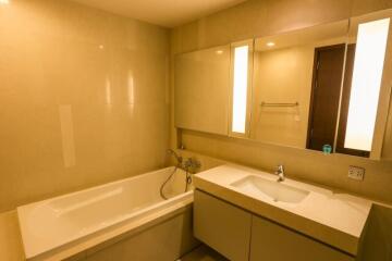 Spacious modern bathroom with tub and vanity