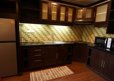 Contemporary kitchen with wooden cabinets and stainless steel appliances