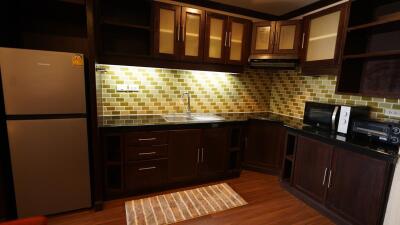 Contemporary kitchen with wooden cabinets and stainless steel appliances