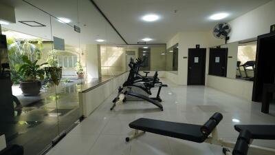 Modern residential gym with exercise equipment and mirrors