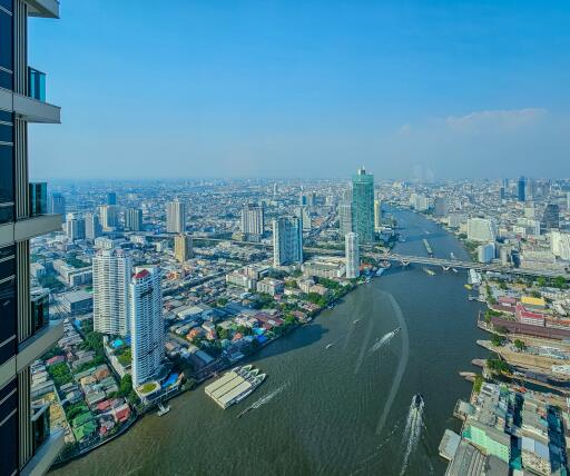 Panoramic city and river view from high-rise apartment window