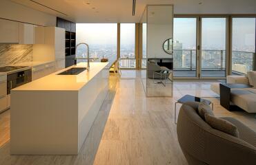 Modern kitchen with open floor plan integrating living room space and panoramic city view