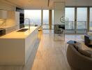 Modern kitchen with open floor plan integrating living room space and panoramic city view