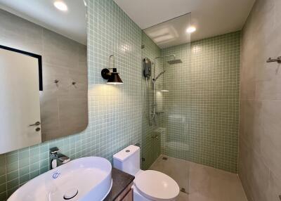 Modern bathroom with double sink and walk-in shower