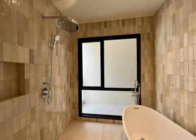 Modern bathroom with large window and bathtub
