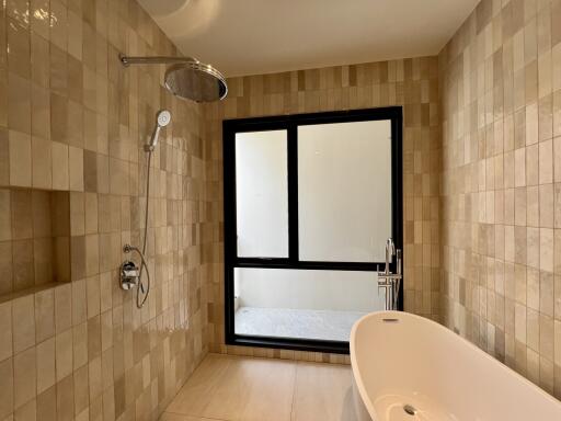Modern bathroom with large window and bathtub