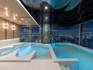 Luxurious indoor swimming pool with city view at nighttime