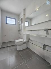 Modern bathroom interior with clean white tiles