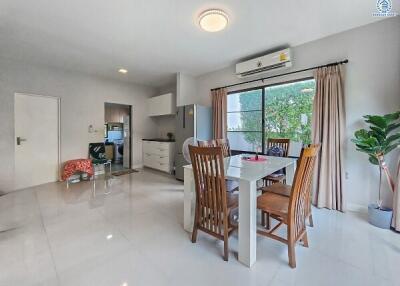 Spacious open plan living and dining area with modern furniture and ample natural light