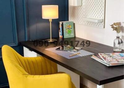 Cozy home office with a modern desk and yellow chair