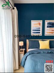 Cozy bedroom with dark blue accent wall and stylish decor