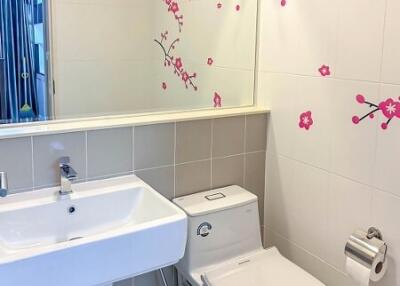 Bright bathroom with decorative flower decals