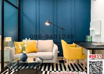 Stylish living room with blue walls, modern furniture, and decorative elements