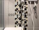 Modern bathroom interior with patterned tiles and shower
