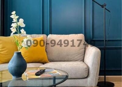 Elegant living room with blue walls and modern decor