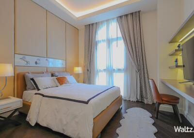 Elegantly designed cozy bedroom with ample lighting