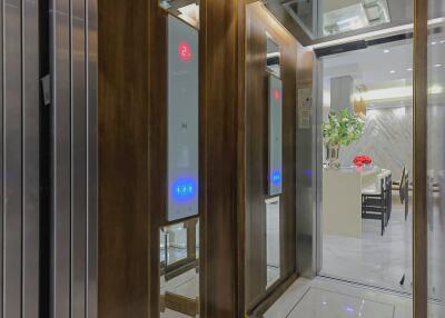 Modern building elevator interior with reflective surfaces