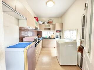 Bright and fully equipped kitchen with modern appliances