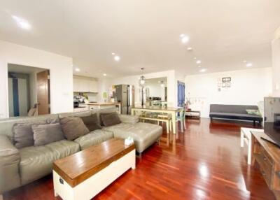 Spacious living room with open floor plan connecting to the kitchen