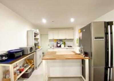 Modern kitchen with stainless steel appliances and a central island