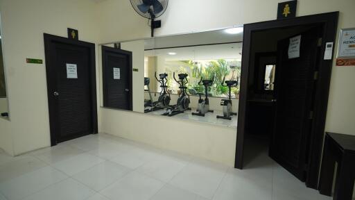 Interior of a small gym room with exercise equipment