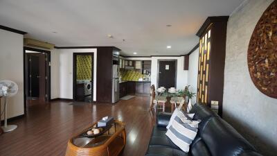 Spacious living room with open layout and modern kitchen