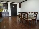 Spacious combined kitchen and dining room with modern amenities and wooden flooring