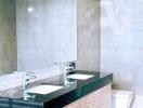 Modern bathroom interior with marble tiles and double sink