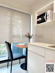 Modern small kitchen with a dining area and large window