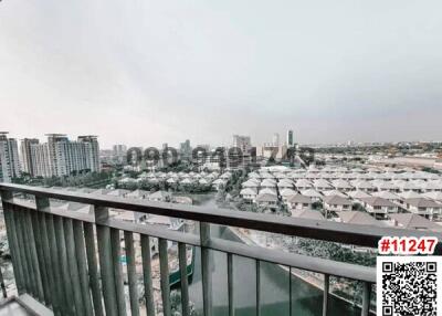 Urban view from an apartment balcony overlooking a residential area