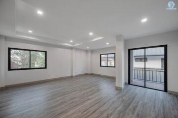 Spacious and well-lit living room with large windows