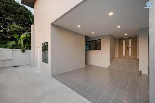 Modern residential building exterior with covered porch area