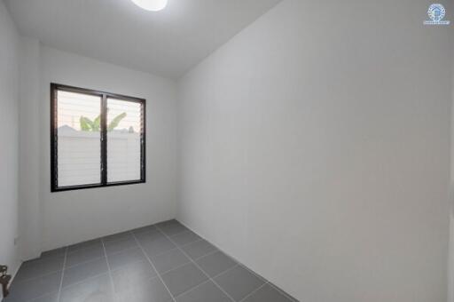 Bright and empty bedroom with tiled flooring and window