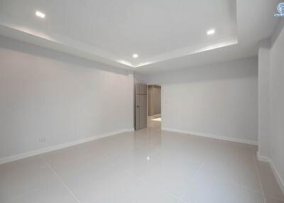 Modern empty room with bright lighting and shiny tiled floor