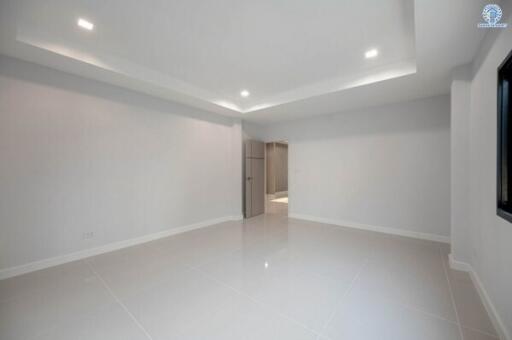 Modern empty room with bright lighting and shiny tiled floor