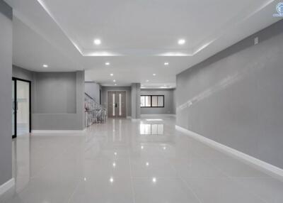 Spacious and modern interior hallway of a building with bright lighting