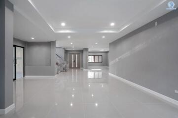 Spacious and modern interior hallway of a building with bright lighting